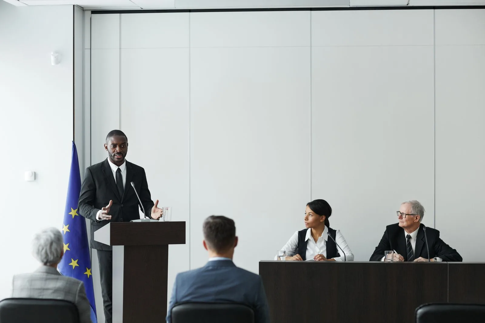 Public-sector leaders participating in a formal policy conference